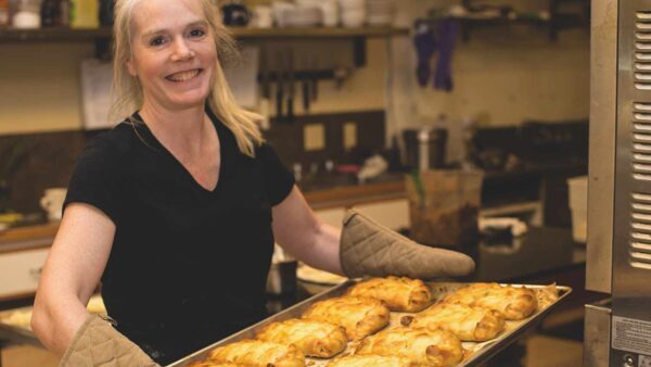 Holly holding a tray of fresh pastries