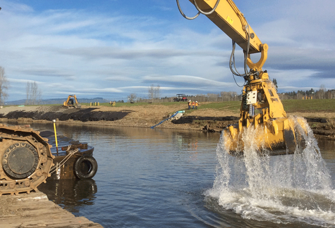 excavator digging in water